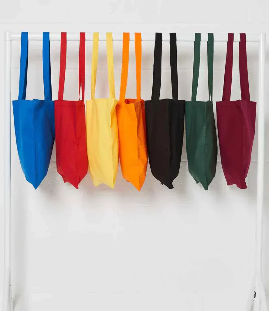 A row of different coloured tote bags on a rail
